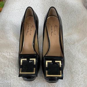 Black patten leather pumps